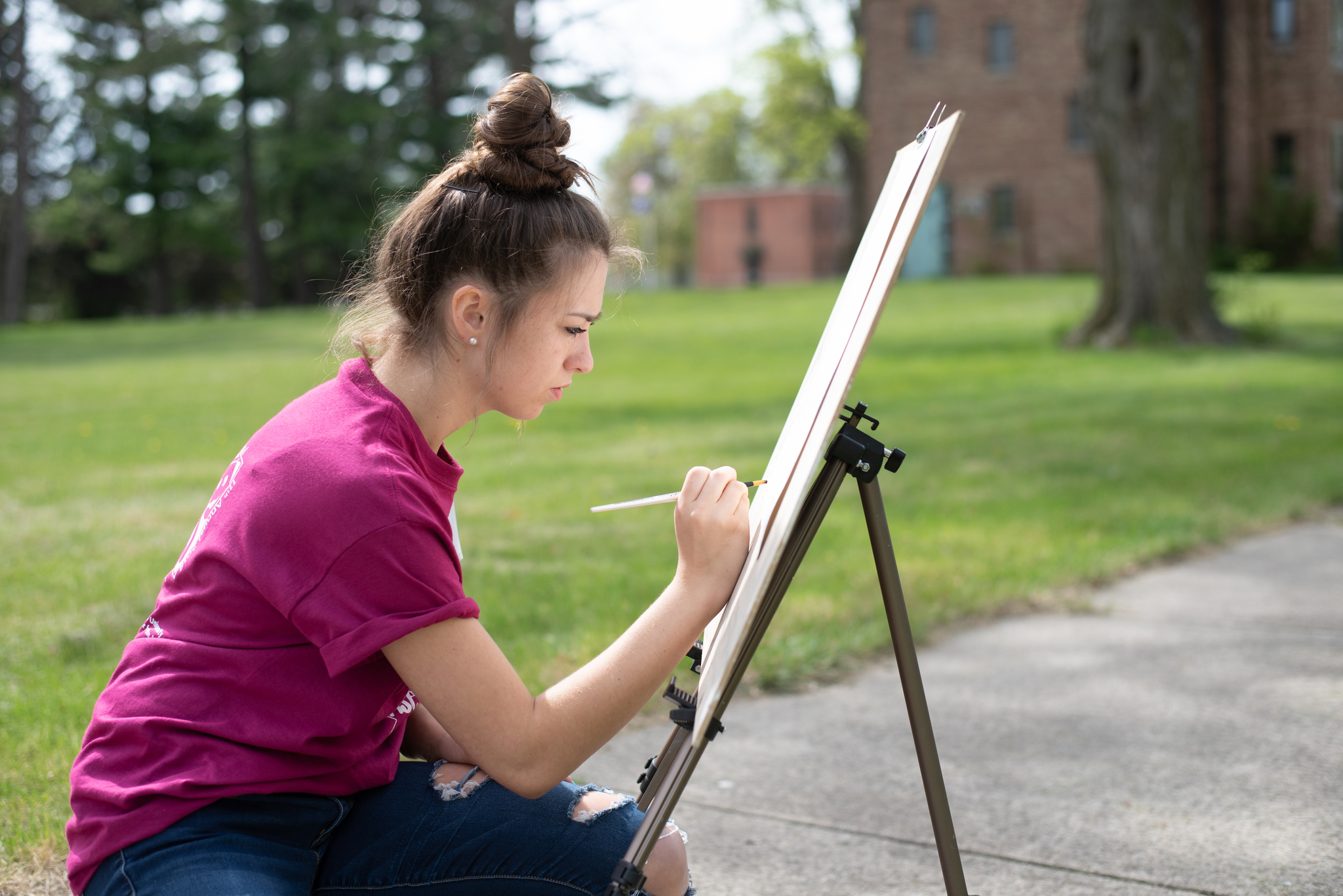 Visual Arts student drawing outside
