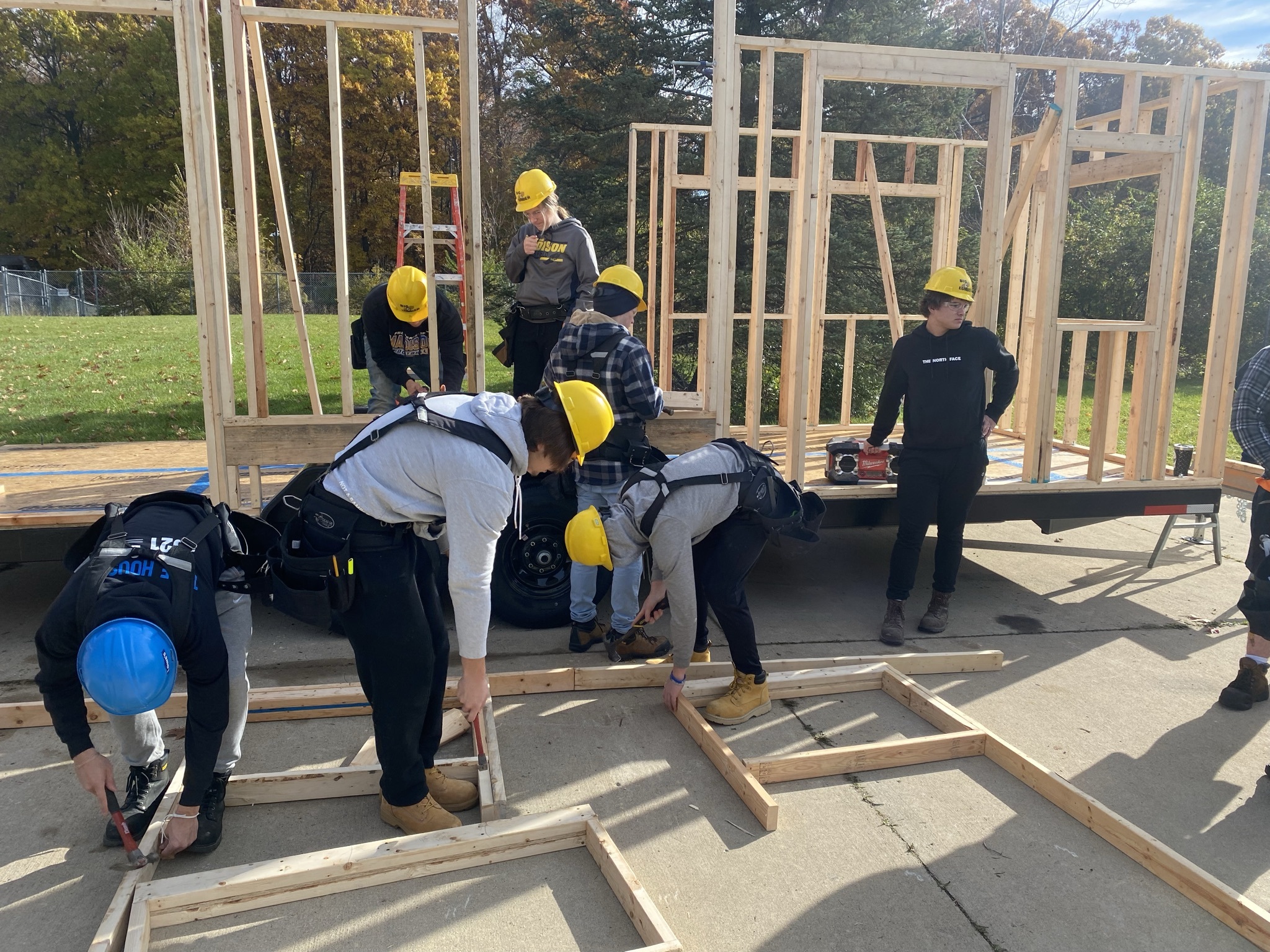 Students building tiny house frame