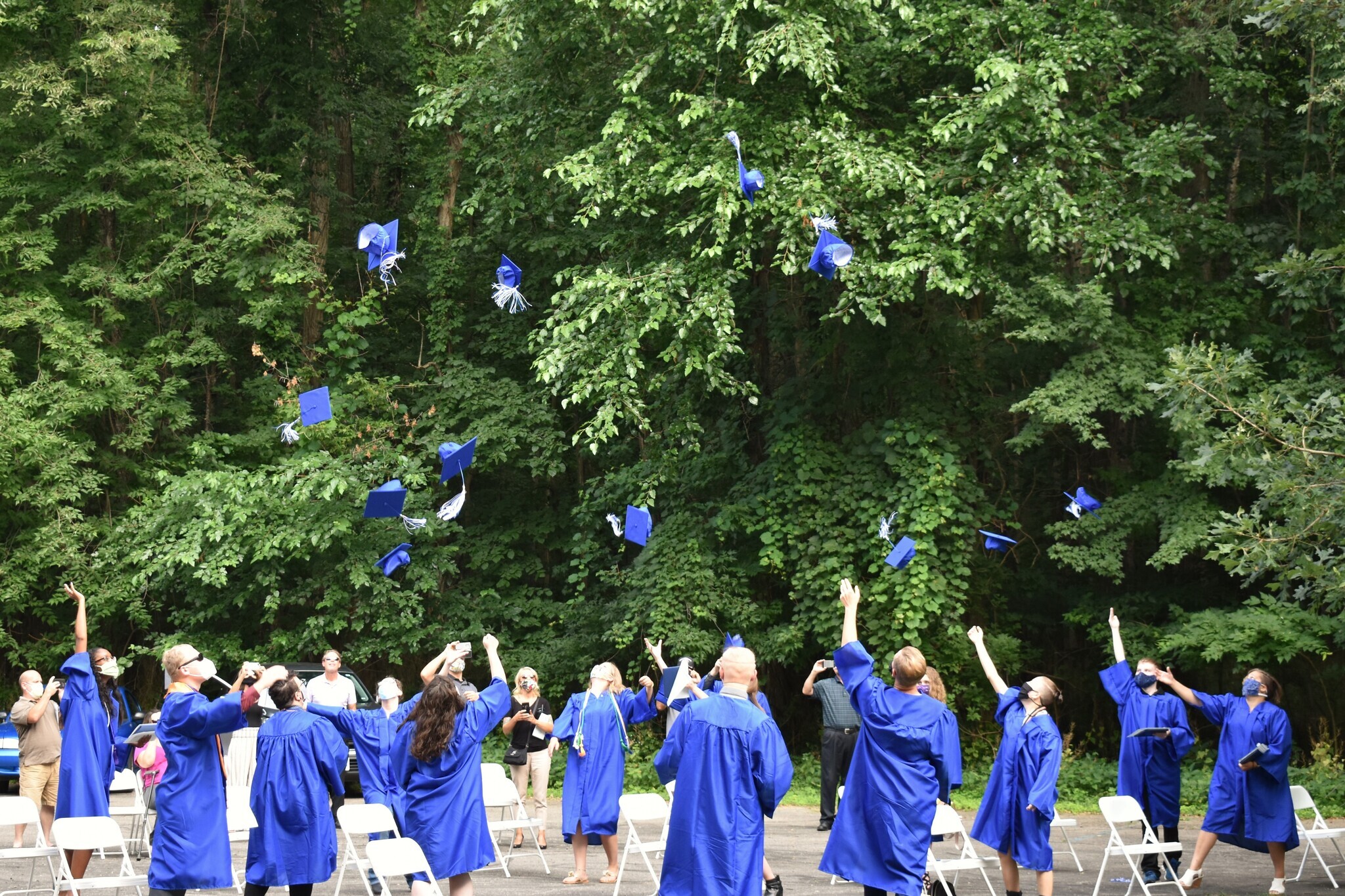 2020 graduates tossing their caps