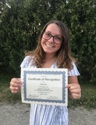 Student holding scholarship certificate