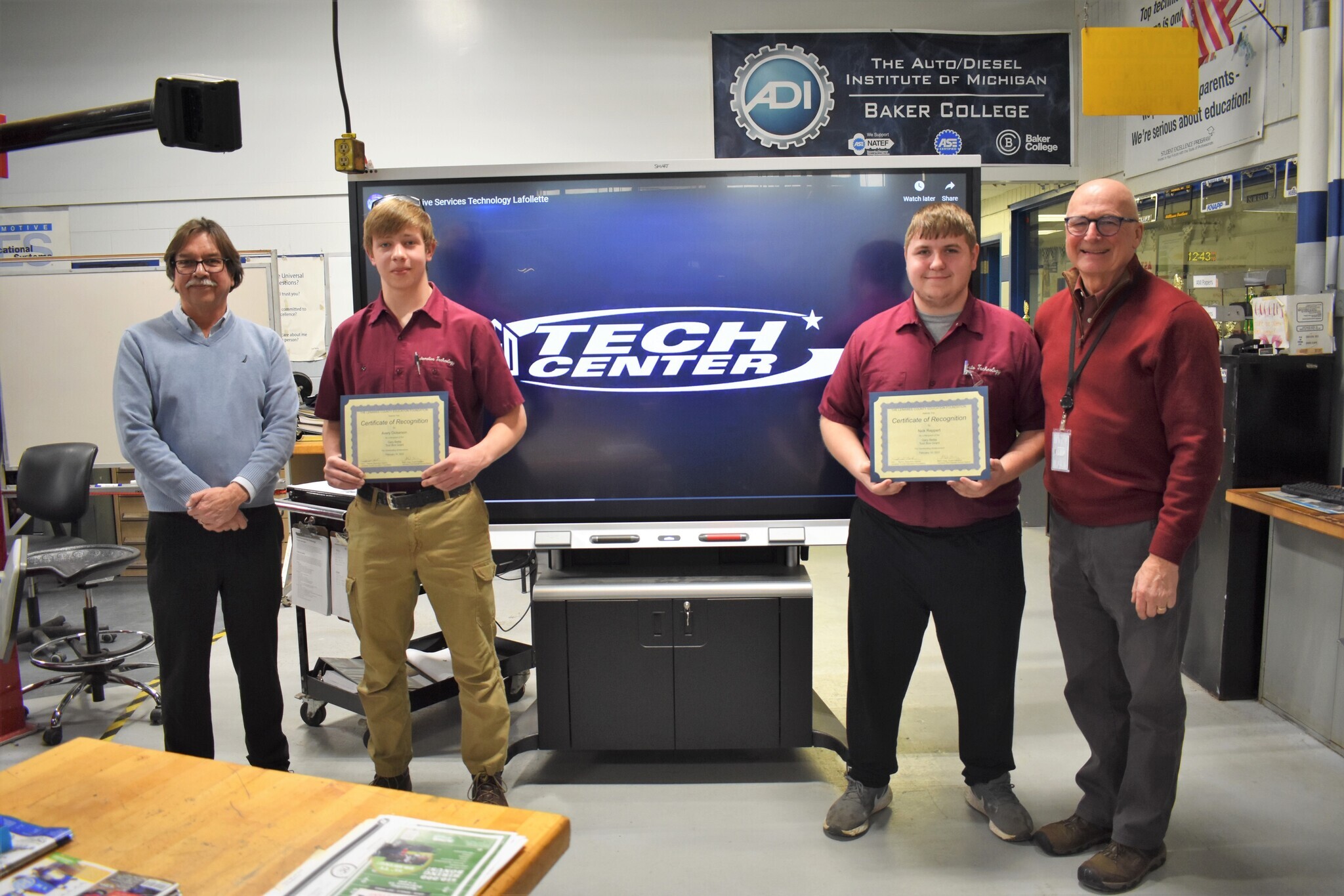 Students Avery and Nick being presented tool grants